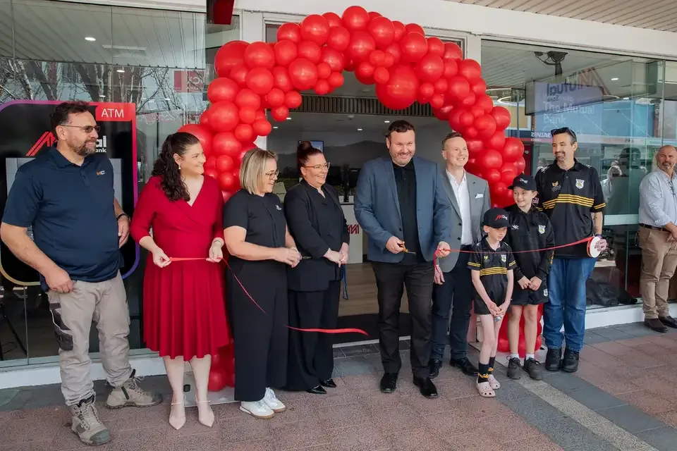 Staff, officials and children at the ribbon cutting for The Mutual Bank Cessnock branch