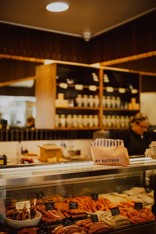 A Hunter butcher, one of the member businesses, at work behind his counter