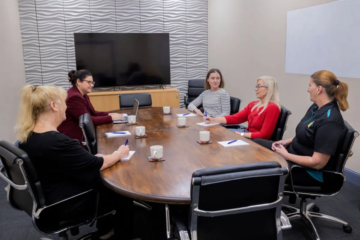 A meeting under way in the Hub board room