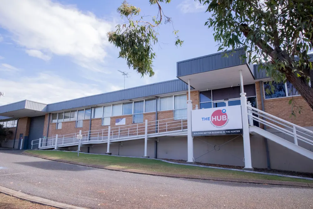The long side of the Hub building in Kurri Kurri, with the units along the lower level