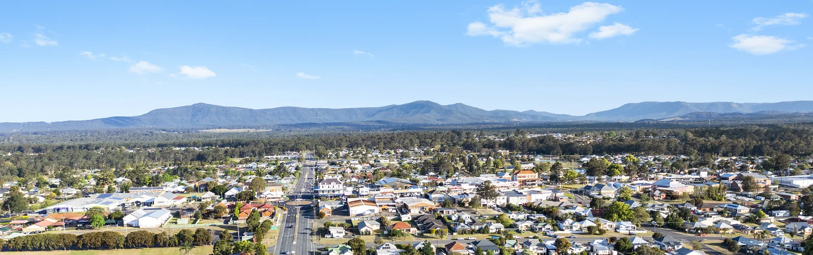 Aerial panorama over Kurri Kurri township looking to the ranges