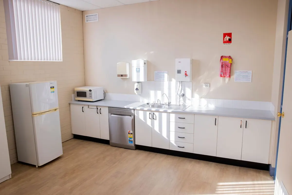 The tenant kitchen at the Hub, with fridge, microwave and bench space